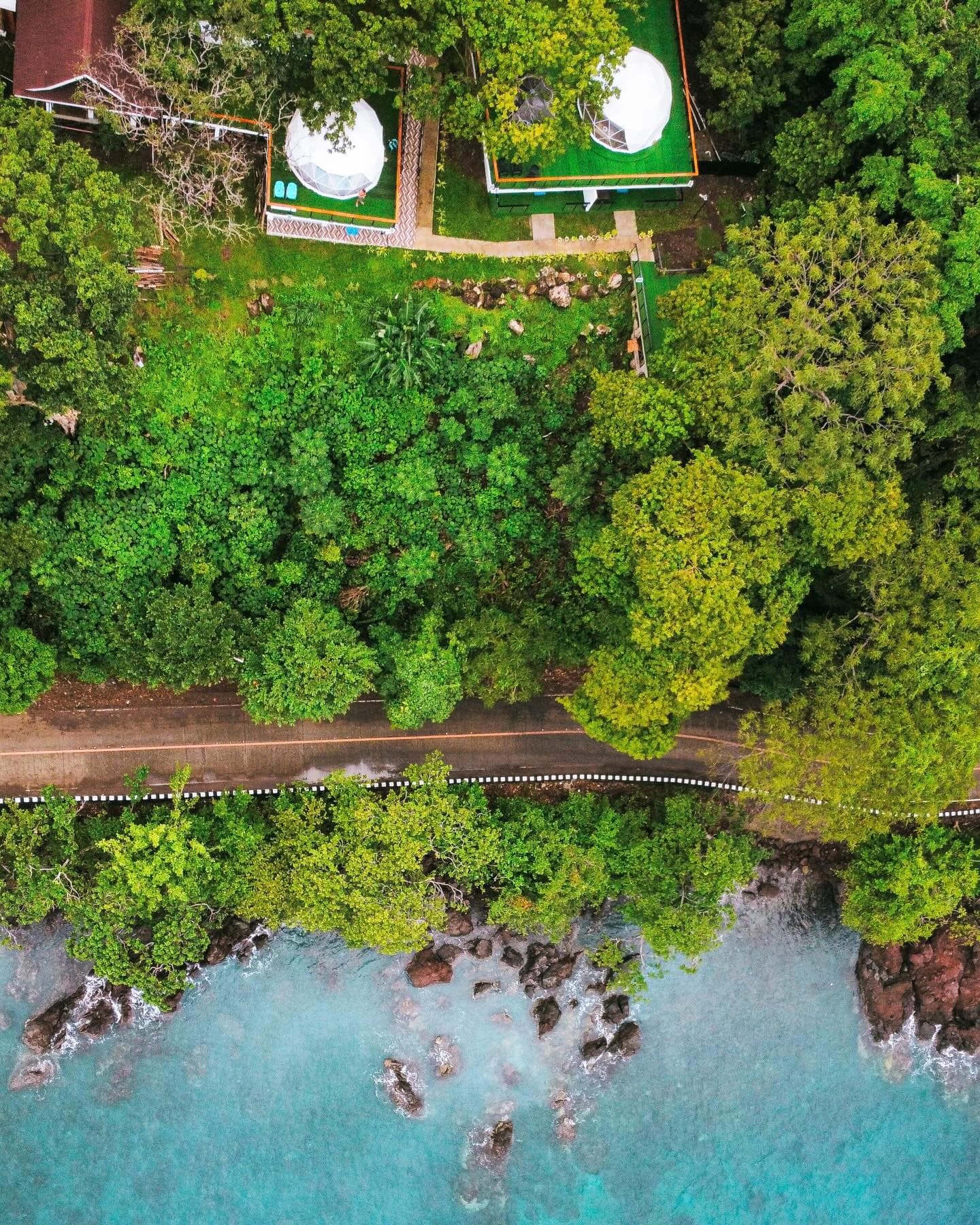 Camiguin's green volcanic interior, where spring-fed waterfalls drop out of the forest above Mambajao